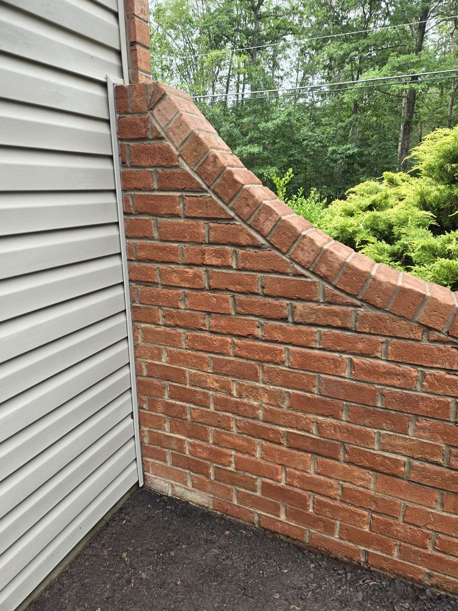 Brick and siding after pressure washing