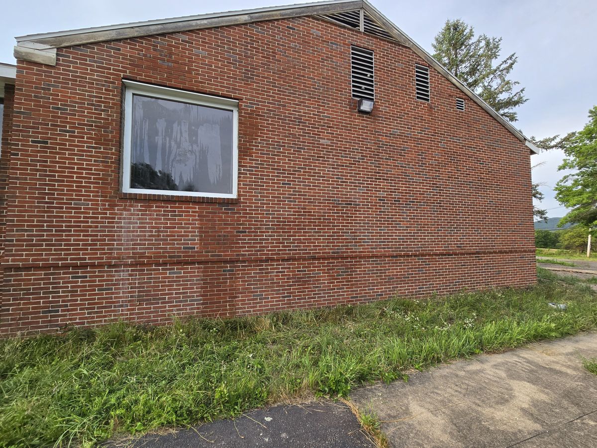 Brick wall cleaned of graffiti